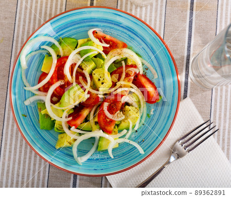 Salad with fresh tomatoes, ripe avocado and onion Salad with fresh tomatoes, ripe avocado and onion 89362891