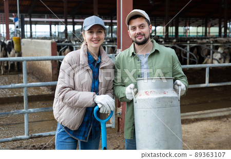 Portrait of man and woman dairy farm workers 89363107