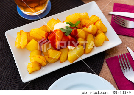 Spanish dish Patatas bravas with hot sauce Spanish dish Patatas bravas with hot sauce 89363389