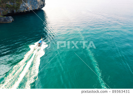 Sea views and rocky islands with a long-tail boat. 89363431