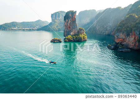 Sea views and rocky islands with a long-tail boat. 89363440