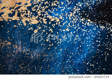 Fluid Art acrylic paints. Abstract mixing blue navi paint waves. Liquid golden flows splashes. Marble effect background or texture Fluid Art acrylic paints. Abstract mixing blue navi paint waves. Liquid golden flows splashes. Marble effect background or texture 89363734