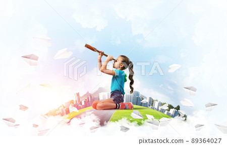 Concept of careless happy childhood with girl looking in future Concept of careless happy childhood with girl looking in future 89364027