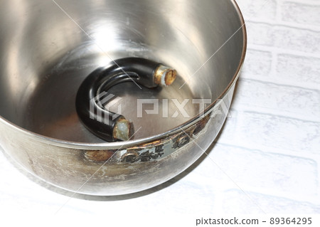 Old pot with a broken handle Old pot with a broken handle 89364295