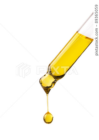 Dropper with cosmetic oil drop isolated on white background. Abstract drop of skin care oil. 89365059