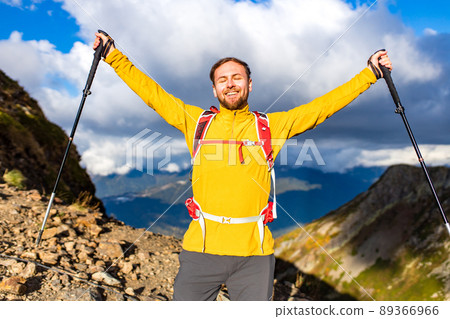 snow white smiling man with braces in mountains . concept of teeth care far from home 89366966