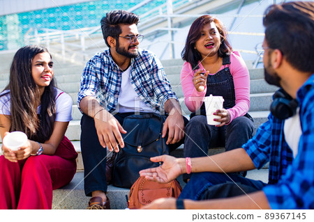 indian ethnicity friendship togetherness in park on sunny day 89367145