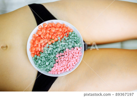 Hair removal with hot wax in bilini zone area Hair removal with hot wax in bilini zone area 89367197