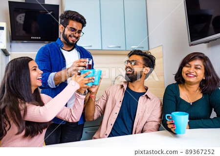 arabian men and women sitting in kitchen and discussing a news arabian men and women sitting in kitchen and discussing a news 89367252
