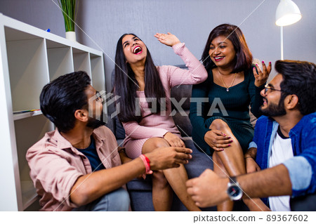 four arabian friends having great time together at home four arabian friends having great time together at home 89367602