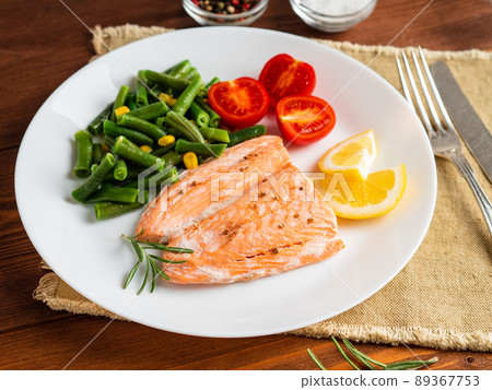 Fish salmon steamed with vegetables. Healthy diet food, dark wooden backdrop Fish salmon steamed with vegetables. Healthy diet food, dark wooden backdrop 89367753