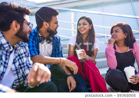 infian best friends spending time together outdoors in spring park infian best friends spending time together outdoors in spring park 89368008