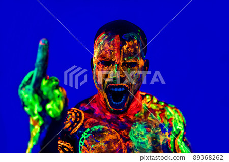 afro american man with UV body art posing in studio 89368262