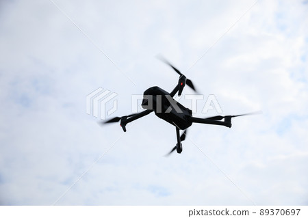 Drone flying in spring forest Drone flying in spring forest 89370697