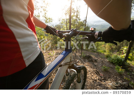 Mountain biking in spring forest Mountain biking in spring forest 89370859