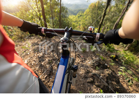 Mountain biking in spring forest Mountain biking in spring forest 89370860