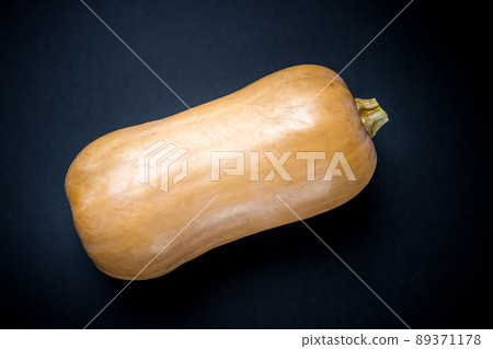 Butternut squash isolated on black background Butternut squash isolated on black background 89371178