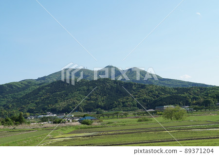 Sakuragawa City, Ibaraki Prefecture, a fresh green rural landscape overlooking Mt. Tsukuba against a blue sky Sakuragawa City, Ibaraki Prefecture, a fresh green rural landscape overlooking Mt. Tsukuba against a blue sky 89371204