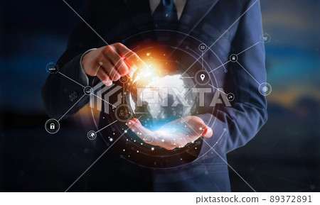 Businessman holding digital datas with world interface with finger. 89372891