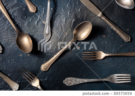 Cutlery pattern. Spoons, forks, and knives. Modern tableware on black Cutlery pattern. Spoons, forks, and knives. Modern tableware on black 89373059