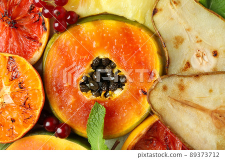 Grilled fruits all over background, close up 89373712