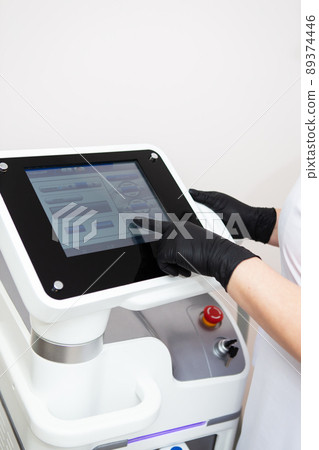 Professional laser hair removal machine, screen for setting up the hair removal process. Professional cosmetology, body epilation. Body care concept. Professional laser hair removal machine, screen for setting up the hair removal process. Professional cosmetology, body epilation. Body care concept. 89374446