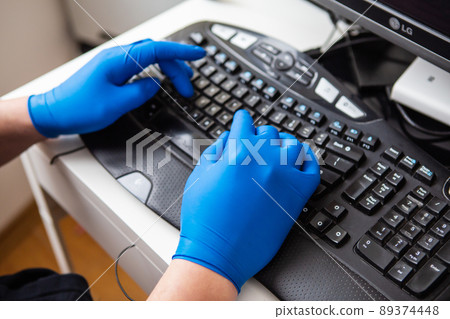 A doctor in blue gloves quickly collects data about a patient. The concept of healthcare and taking care of your health. A doctor in blue gloves quickly collects data about a patient. The concept of healthcare and taking care of your health. 89374448