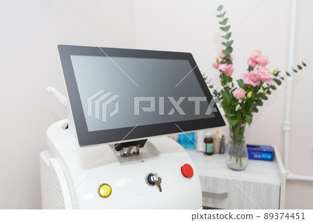 Professional laser hair removal machine, screen for setting up the hair removal process. Professional cosmetology, body epilation. Body care concept. Professional laser hair removal machine, screen for setting up the hair removal process. Professional cosmetology, body epilation. Body care concept. 89374451