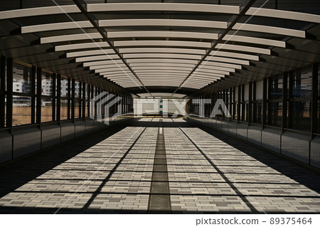 Abstract painting: A pattern of light and shadow, a symmetrical painting of a long connecting bridge between buildings 89375464