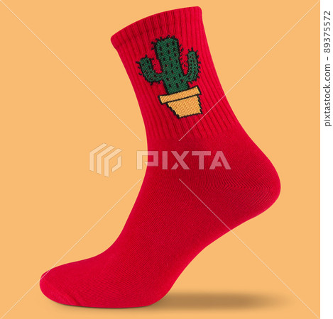 voluminous red sock with a green cactus pattern, on a yellow background, casting a shadow 89375572