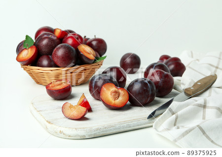Concept of fruit with plums on white background Concept of fruit with plums on white background 89375925