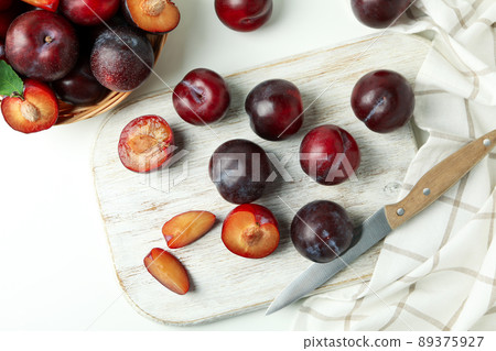 Concept of fruit with plums on a white background Concept of fruit with plums on a white background 89375927