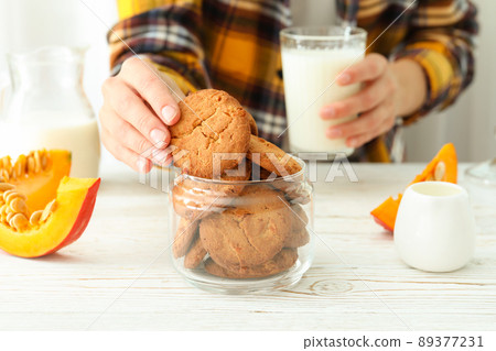 Concept of tasty eating with pumpkin cookies Concept of tasty eating with pumpkin cookies 89377231