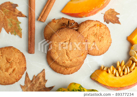 Pumpkin cookies on white textured background, top view Pumpkin cookies on white textured background, top view 89377234