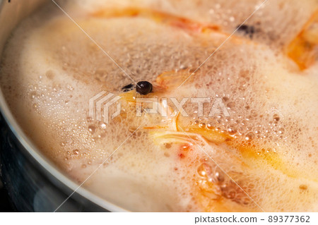 Shrimps boiling in hot water.Prawns boil in kitchen. Delicious sea food for dinner. Selective focus 89377362