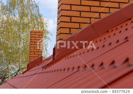Roof housetop with red roofing tiles Roof housetop with red roofing tiles 89377629