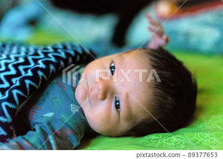 Portrait of a lying newborn baby Portrait of a lying newborn baby 89377653