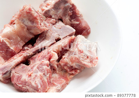 Raw pork bone isolated on white background. Raw pork bone isolated on white background. 89377778