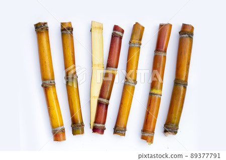Sugar cane on white background. 89377791