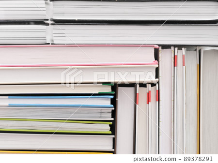 books stacked in a pattern. background for back to school concept. pile of hardcovered books 89378291
