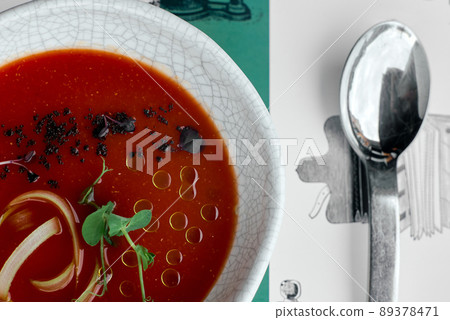 red soup, borscht, basil on the table with a spoon coarse red soup, borscht, basil on the table with a spoon coarse 89378471