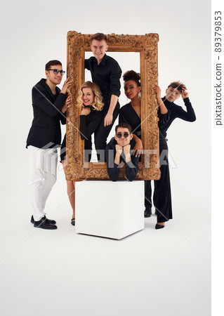 studio portrait of Beautiful young diverse group of friends isolated on white background in the frame for a picture, goofy face, good mood studio portrait of Beautiful young diverse group of friends isolated on white background in the frame for a picture, goofy face, good mood 89379853