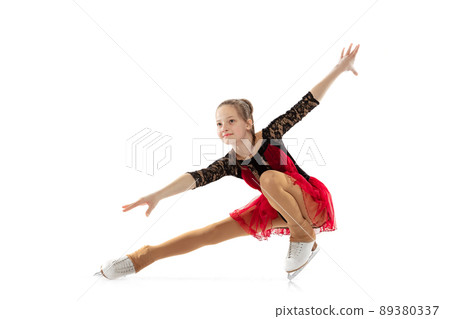 Portrait of little flexible girl, figure skating wearing stage attire posing isolated on white studio backgound. Concept of movement, sport, beauty. Portrait of little flexible girl, figure skating wearing stage attire posing isolated on white studio backgound. Concept of movement, sport, beauty. 89380337