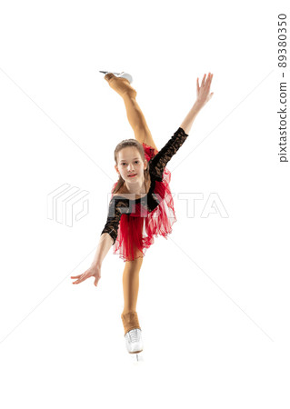 Portrait of little flexible girl, figure skater wearing stage attire posing isolated on white studio background. Concept of movement, sport, beauty. 89380350