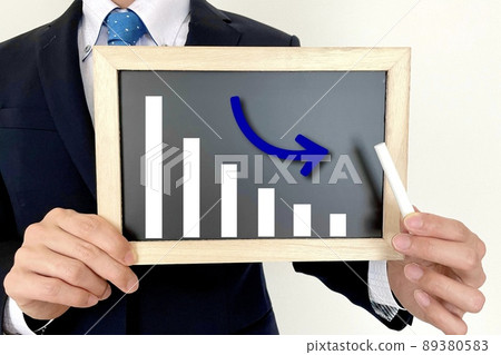 Office worker with a falling graph Office worker with a falling graph 89380583