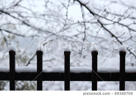 A photo of a snow-capped fence 89380709