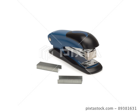 Photo of stapler on white background and staples nearby 89381631