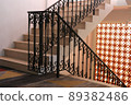 The vintage metal style, stair railing with orange bricks light wall 89382486