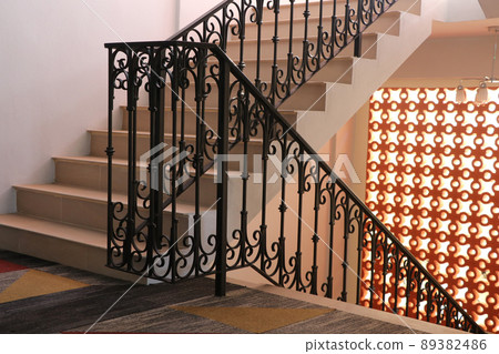 The vintage metal style, stair railing with orange bricks light wall The vintage metal style, stair railing with orange bricks light wall 89382486