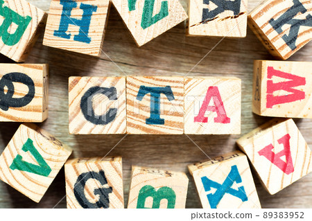 Alphabet letter block in word CTA (Abbreviation of Call to action or Chartered tax adviser) with another on wood background 89383952